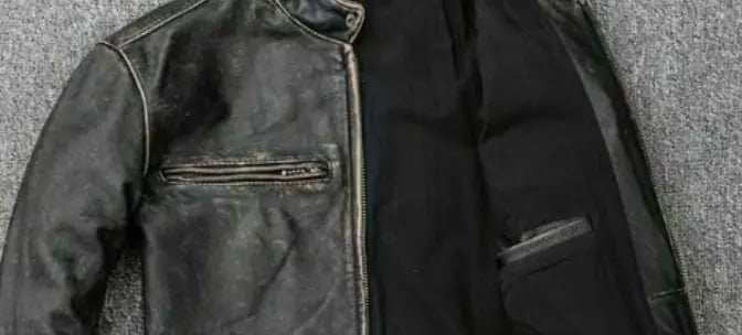 Blackened leather jacket showing darkened areas and discoloration due to various causes