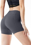 Women's high waisted yoga shorts in dark grey, showcasing a flattering fit and seamless design.