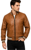 A man wearing a brown faux-leather bomber jacket with beige and white striped ribbed collar, cuffs, and hem, paired with black pants, against a plain white background.