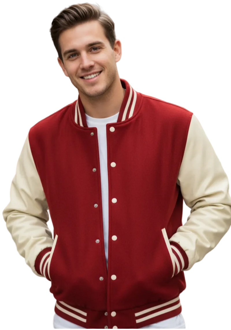 A smiling young man wearing a classic varsity jacket with a deep red body and cream-colored sleeves, standing outdoors with a blurred brick building in the background.