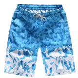 Stylish blue beach shorts for men with vibrant floral print, perfect for summer activities and quick drying.