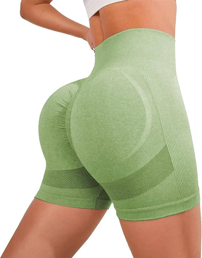 Professional women's high waisted green cycling shorts with seamless design and ribbed waistband for comfort and support.
